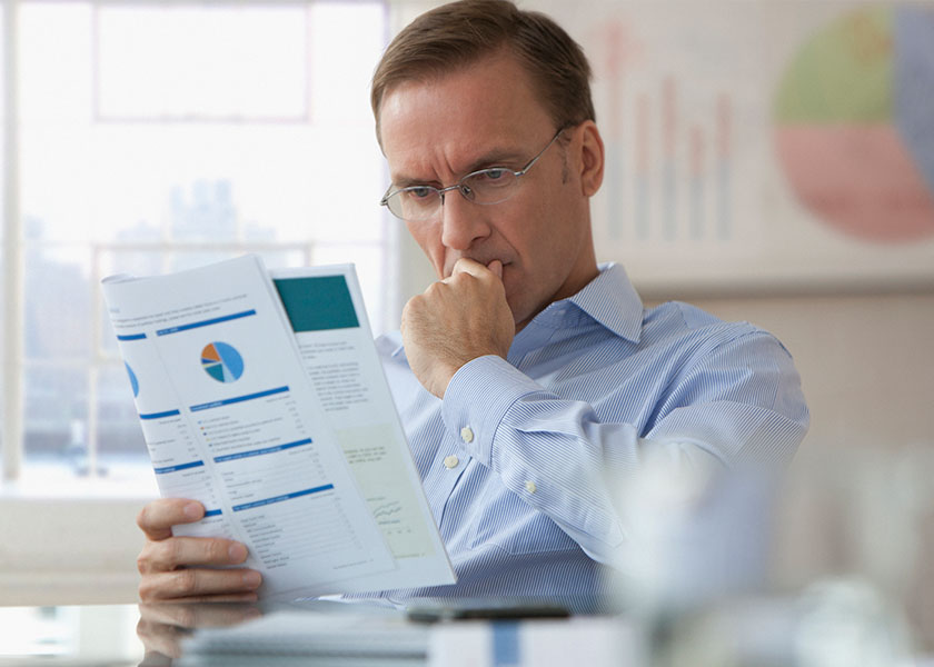 man reading paperwork